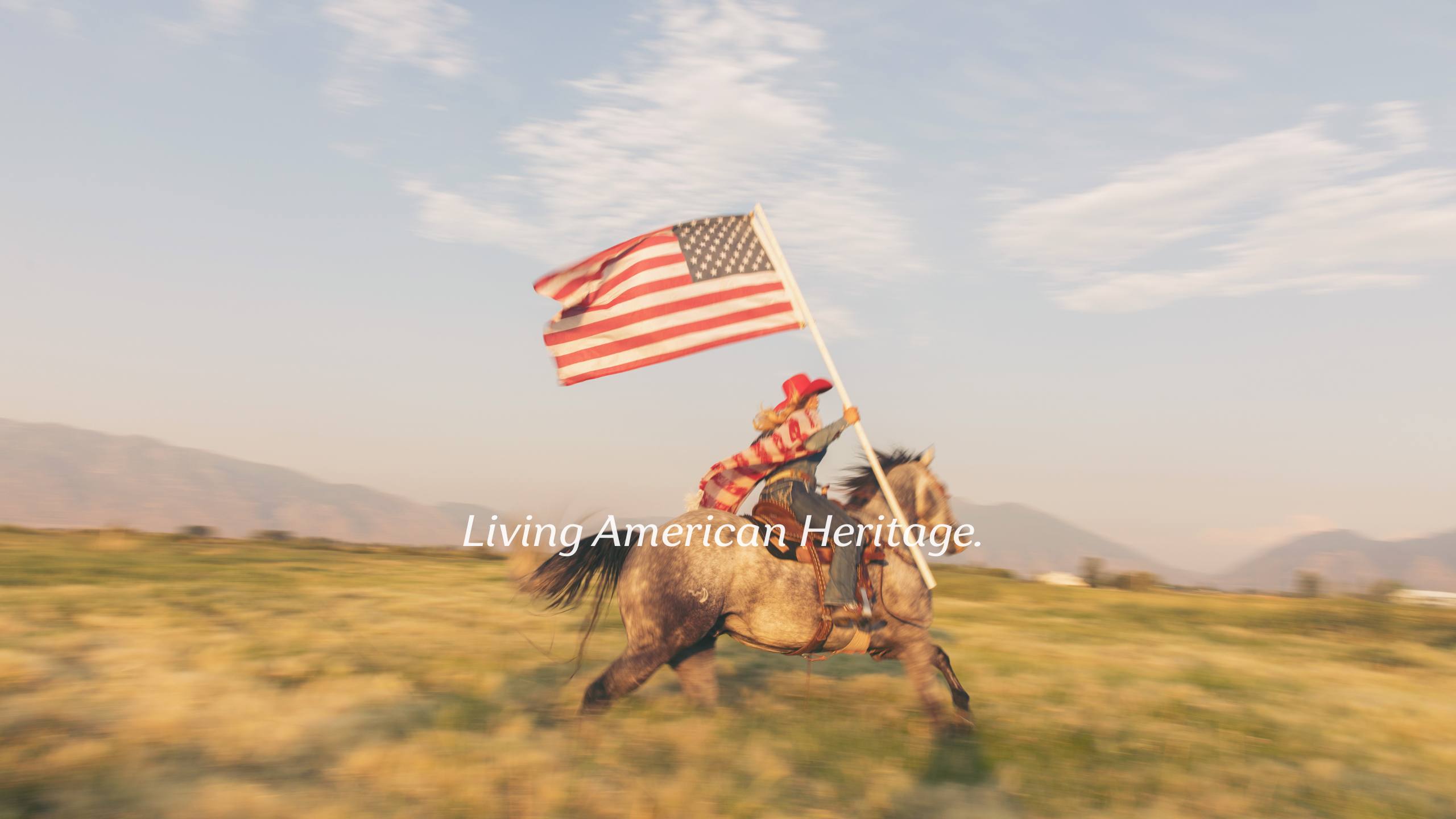Person riding a horse holding an American flag with 'Living American Heritage' text.