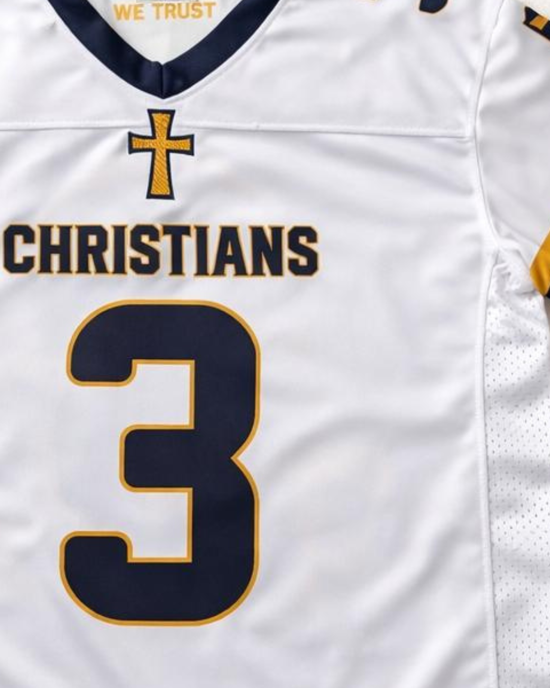 White sports jersey with 'Christians' and number '3', featuring a cross logo.